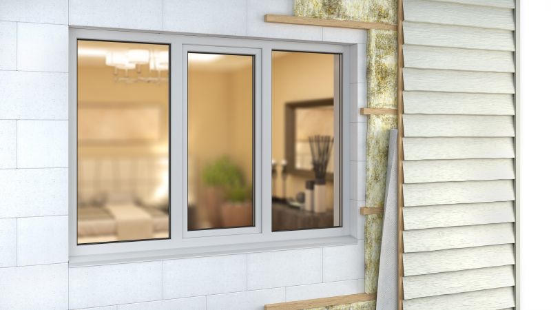 Siding being installed around windows